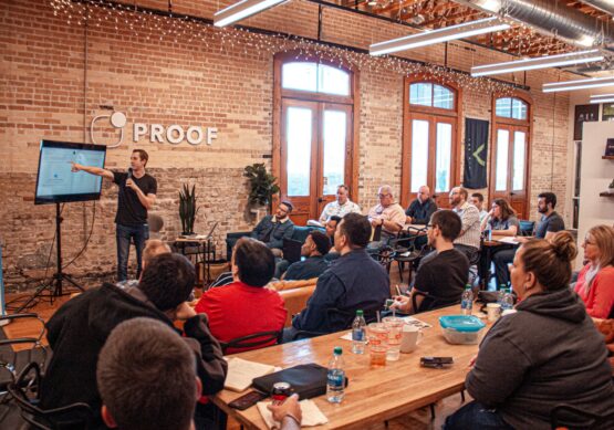 Photo by Matthew Osborn people sitting on chair in front of table